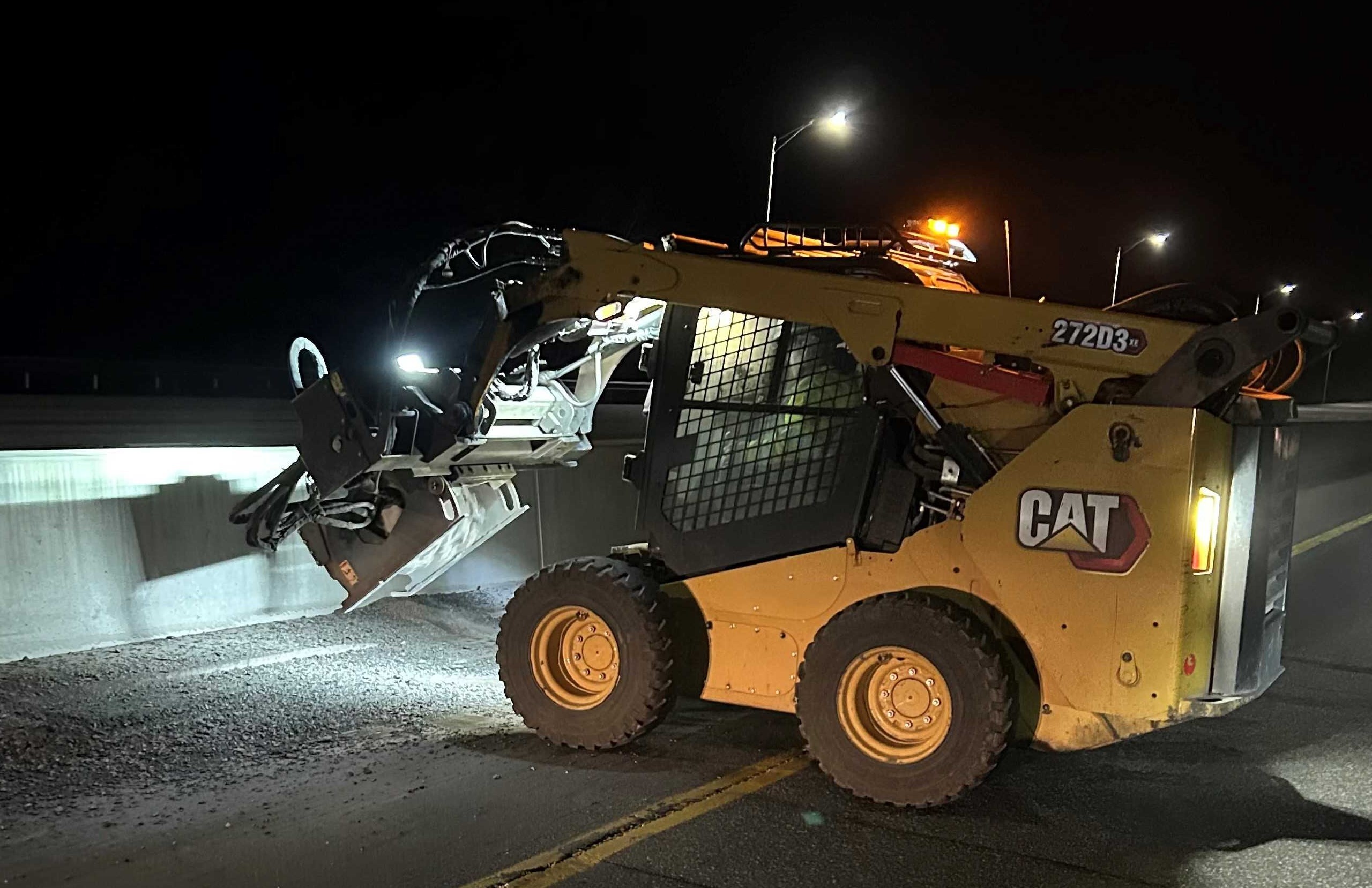 A-skid-steer-grinds-around-a-storm-drain-in-April-2025.jpg