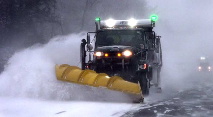 Snowplow with green lights